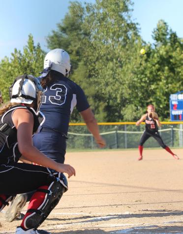 Senior Kaylee Sheridan watches the ball fly after hitting a line drive against Winfield.