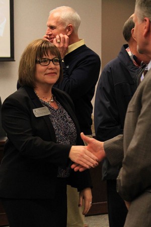 Newly named superintendent Mary Hendricks-Harris shakes hands with human resource officer Dr. Steve Griggs on Thursday, Feb. 4. Dr. Henricks-Harris is currently the chief academic officer in the district and beat out two other finalists for the position and will assume the office on July 1.