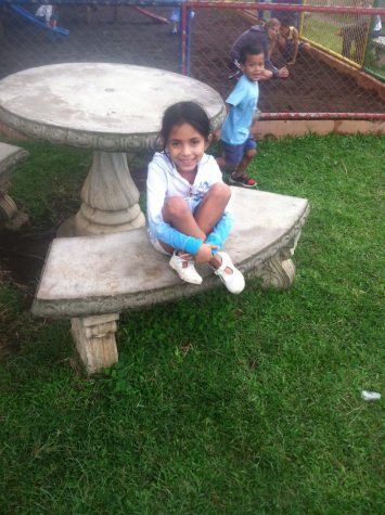 Everyday after school, the students would eat lunch at the orphange, located right next to the school, following lunch we all would walk about a block or two to the playground. This is Allison sitting at a table at the playground.